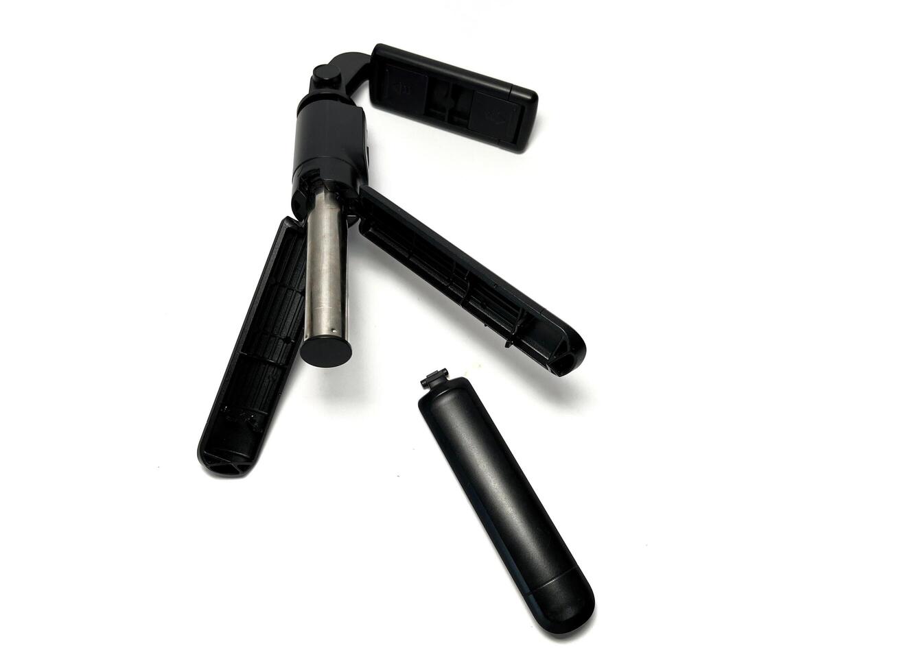 Broken mobile phone tripod isolated on white background with clipping path. Studio shot. photo