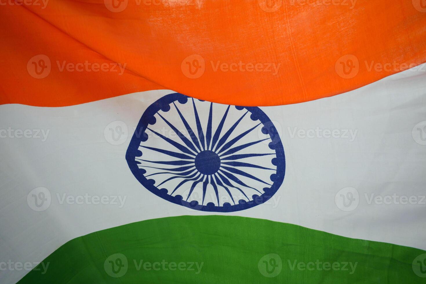 Soft watercolor strokes blending saffron, white, and green with an Ashoka Chakra outline photo