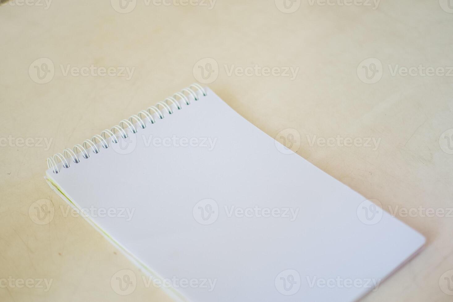 blank notebook on white table, business concept photo