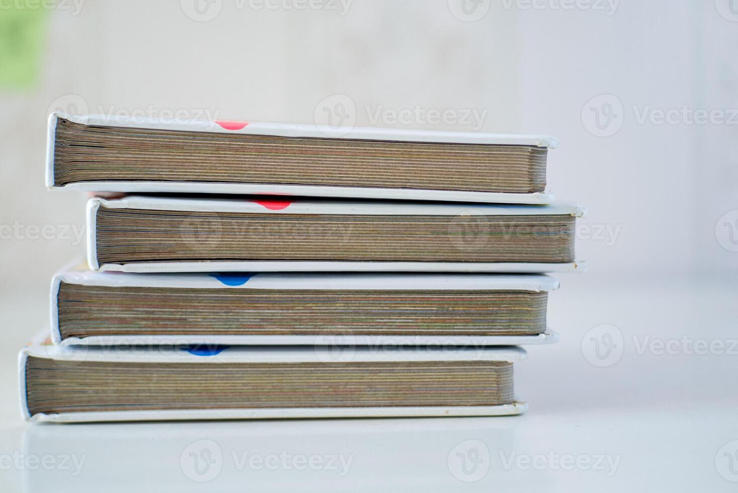 Stack of children story books on the white table photo
