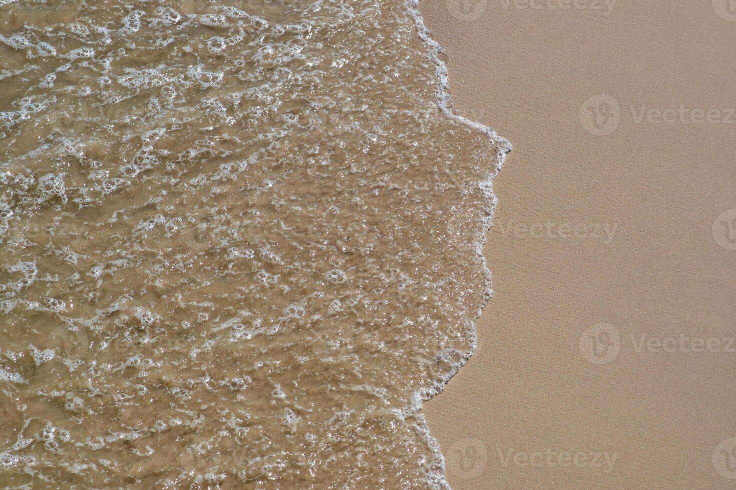 Beautiful sea water and sandy beach photo