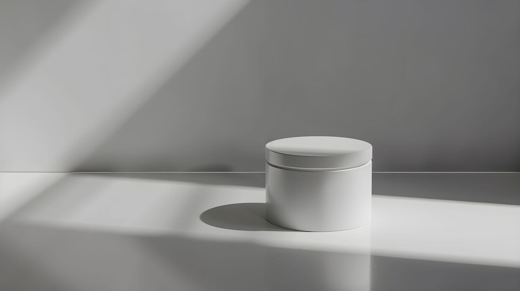 A white container sitting on a table in front of a wall photo