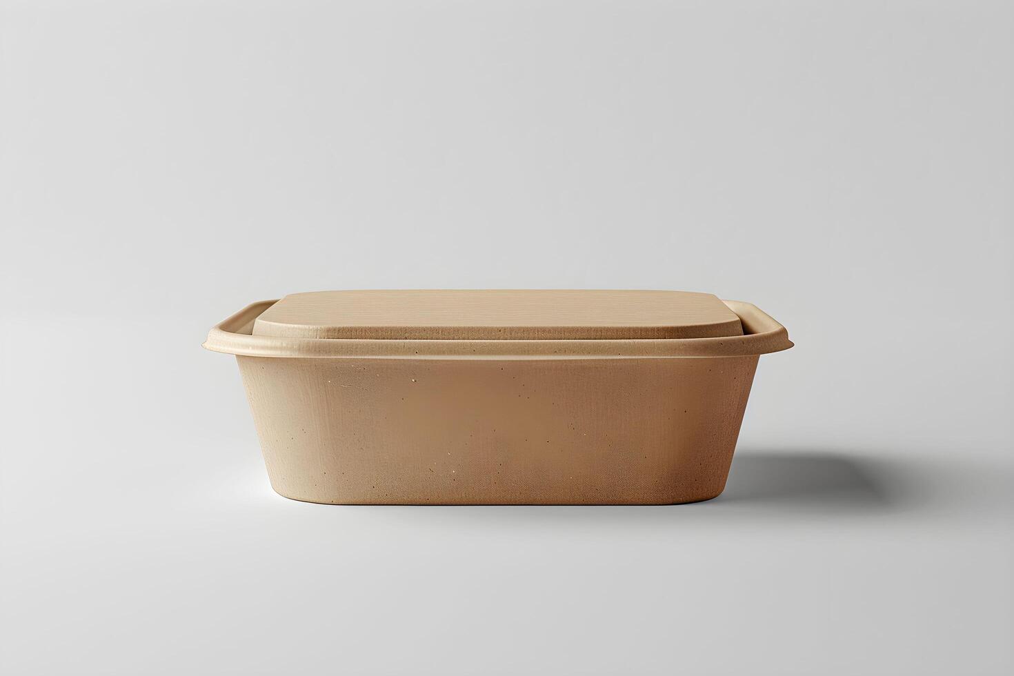 A plastic container with a lid on a white surface photo