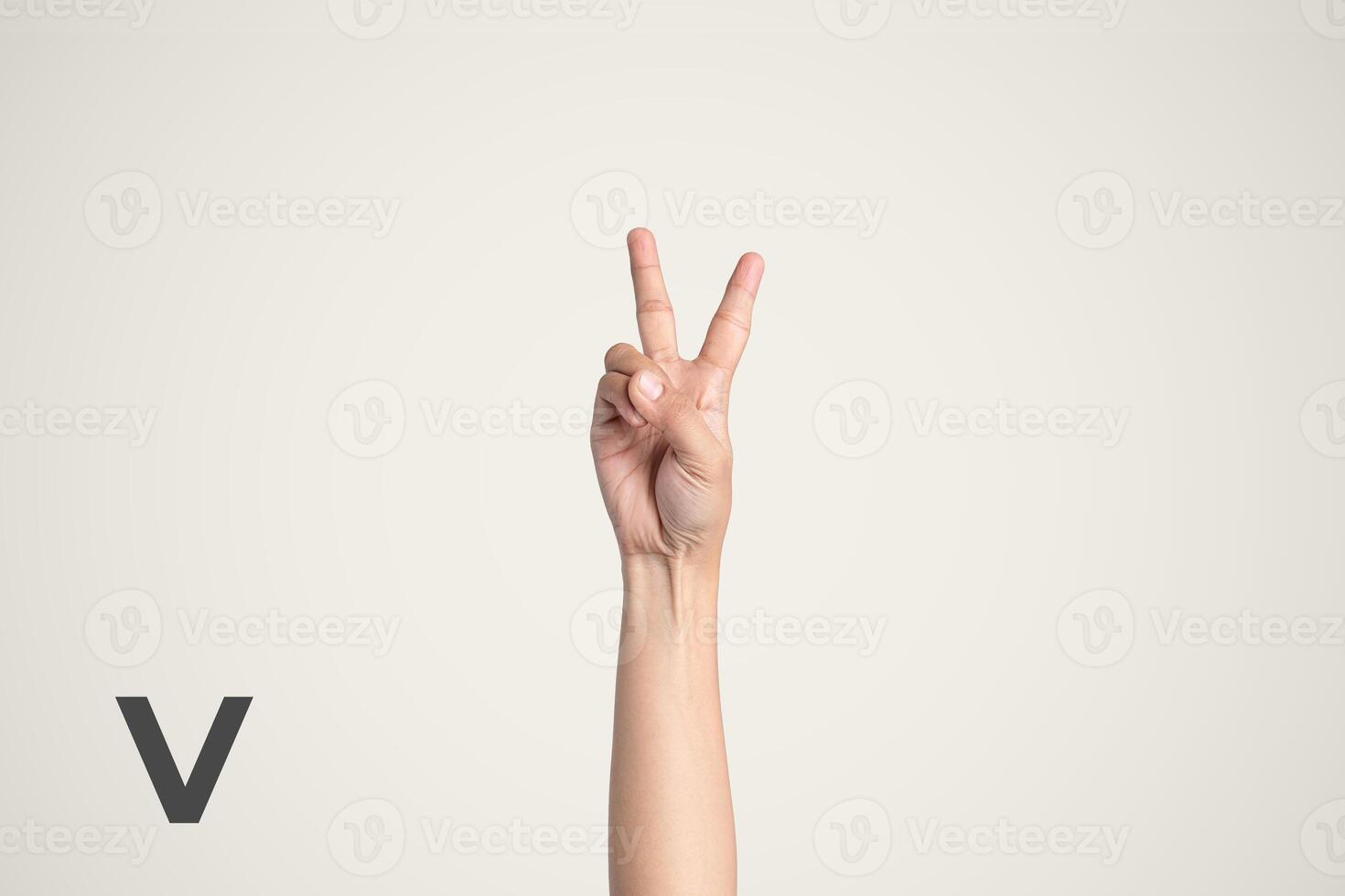 Deaf Sign alphabet of V, American Sign Language ASL. Isolated object Finger spelling the alphabet photo