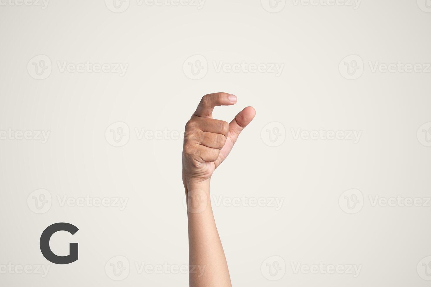 Deaf Sign alphabet of G, American Sign Language ASL. Isolated object Finger spelling the alphabet photo