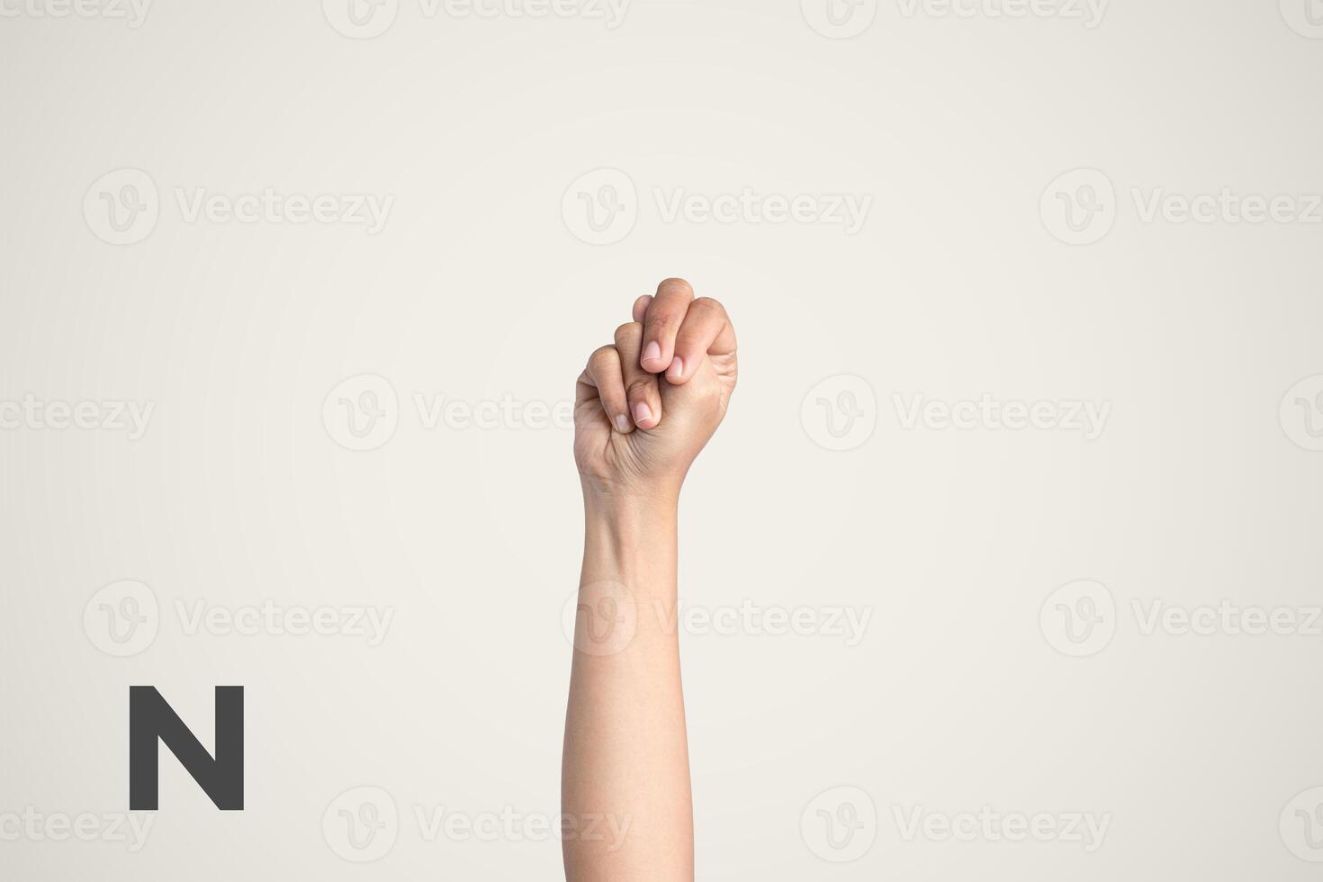 Deaf Sign alphabet of N, American Sign Language ASL. Isolated object Finger spelling the alphabet photo