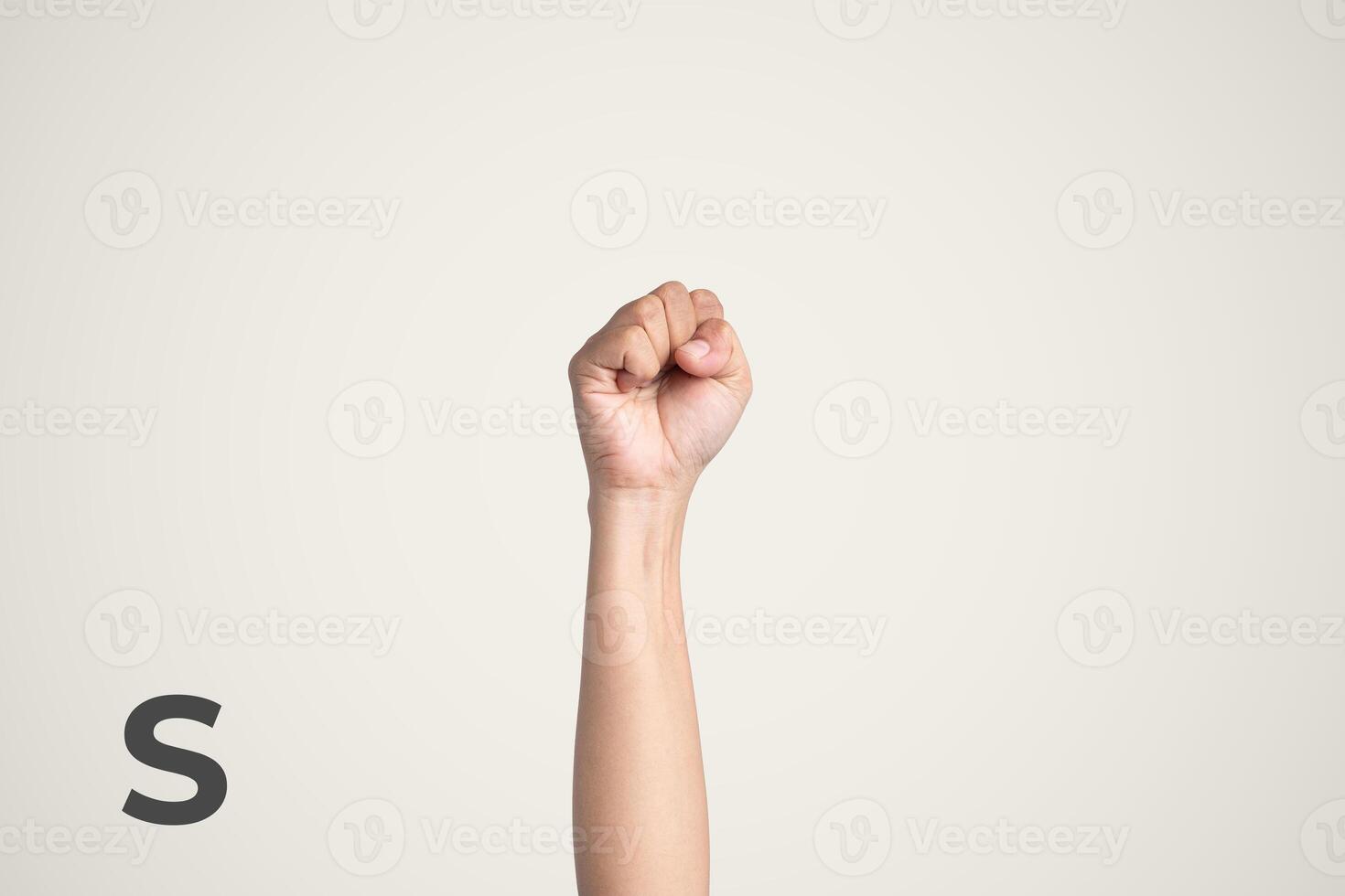 Deaf Sign alphabet of S, American Sign Language ASL. Isolated object Finger spelling the alphabet photo