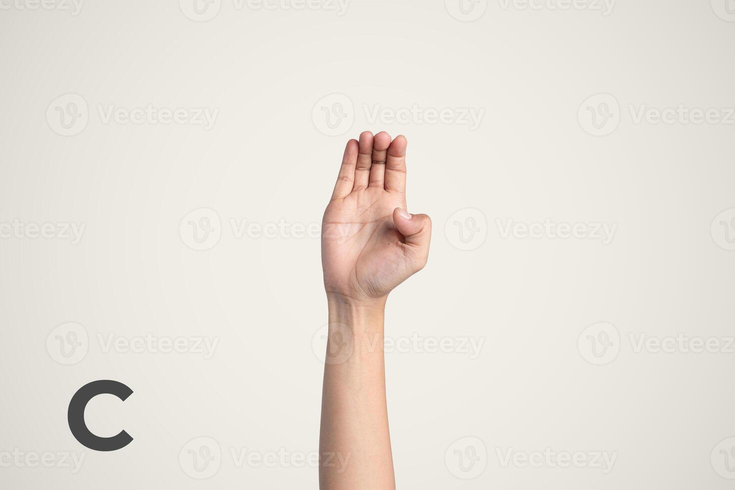 Deaf Sign alphabet of C, American Sign Language ASL. Isolated object Finger spelling the alphabet photo