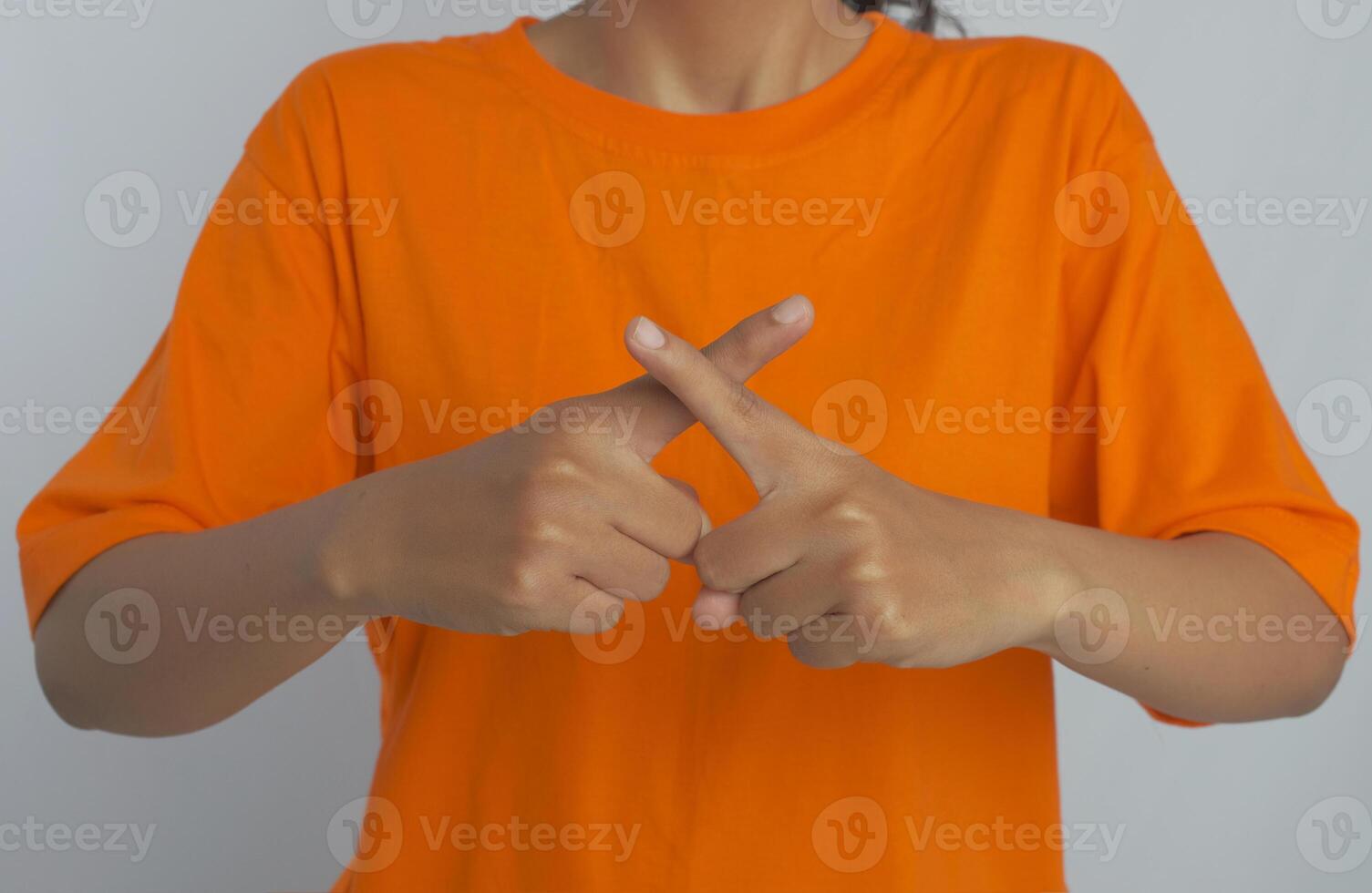 A person making a no or stop sign with their hands photo