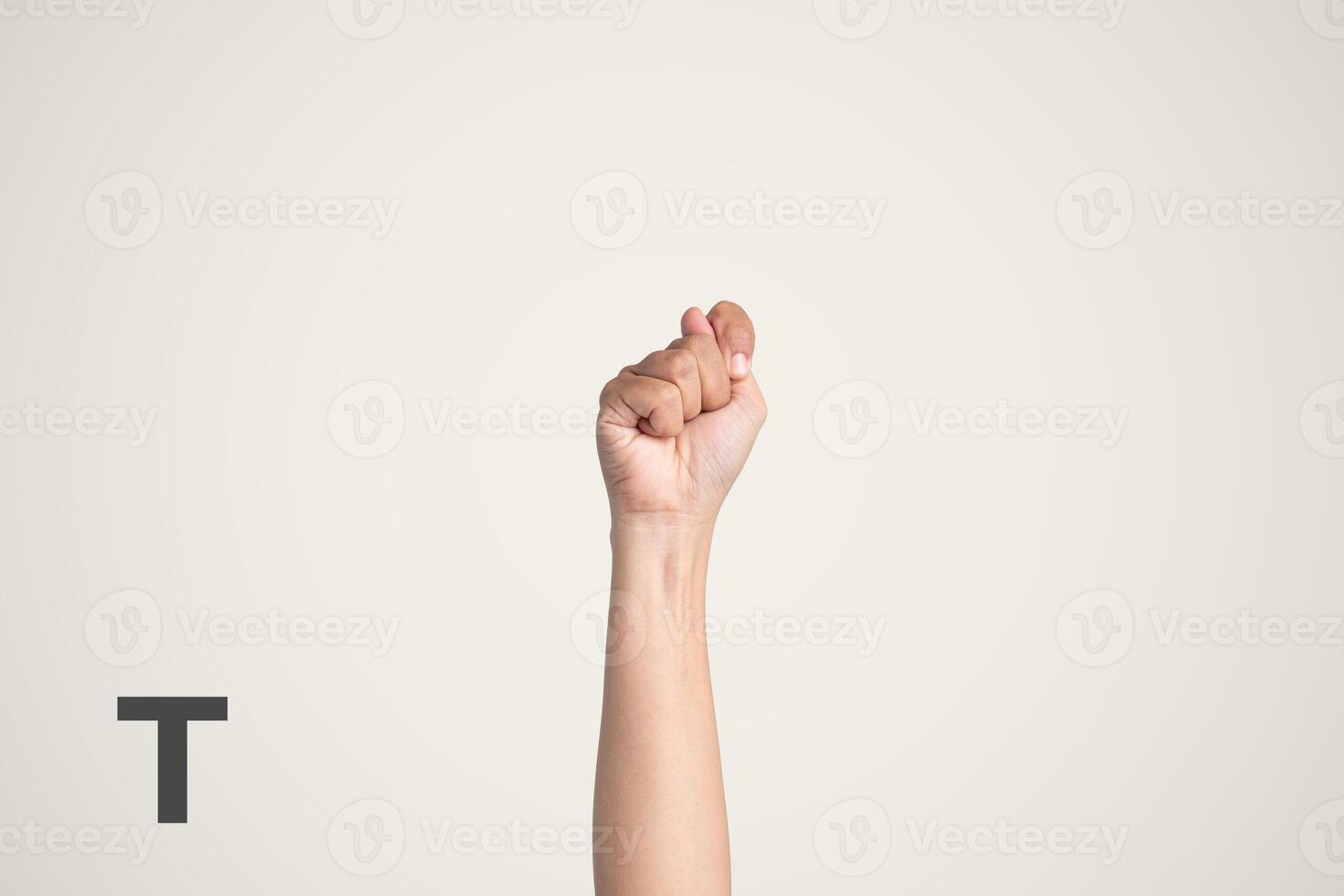 Deaf Sign alphabet of T, American Sign Language ASL. Isolated object Finger spelling the alphabet photo