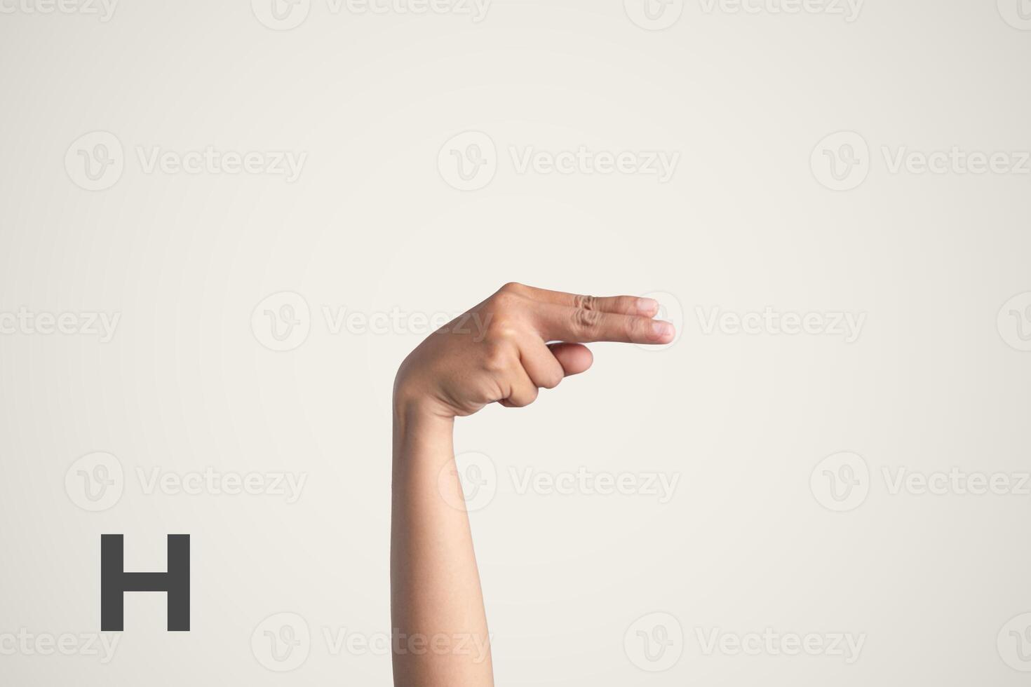 Deaf Sign alphabet of H, American Sign Language ASL. Isolated object Finger spelling the alphabet photo