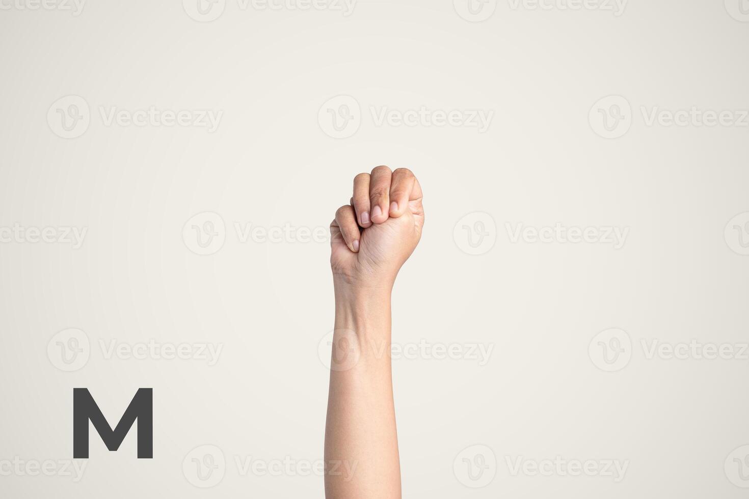 Deaf Sign alphabet of M, American Sign Language ASL. Isolated object Finger spelling the alphabet photo