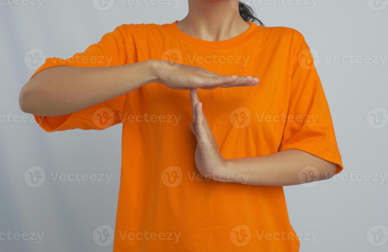A person making a time out gesture with both hands photo