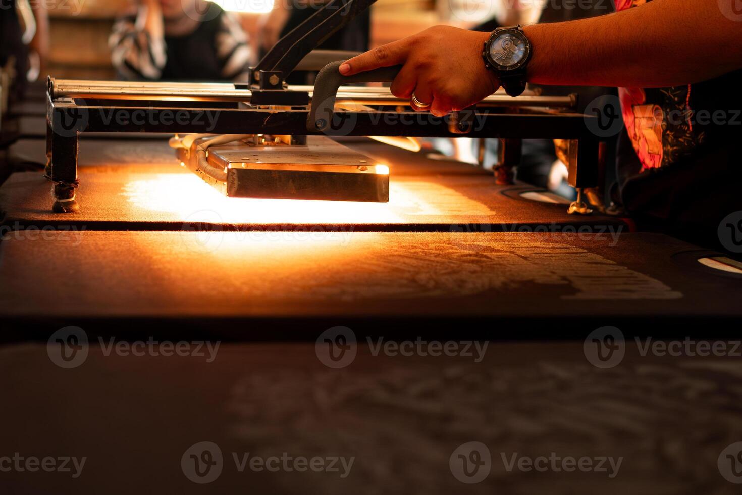 Black shirt is burned with curing or conveyor machine photo