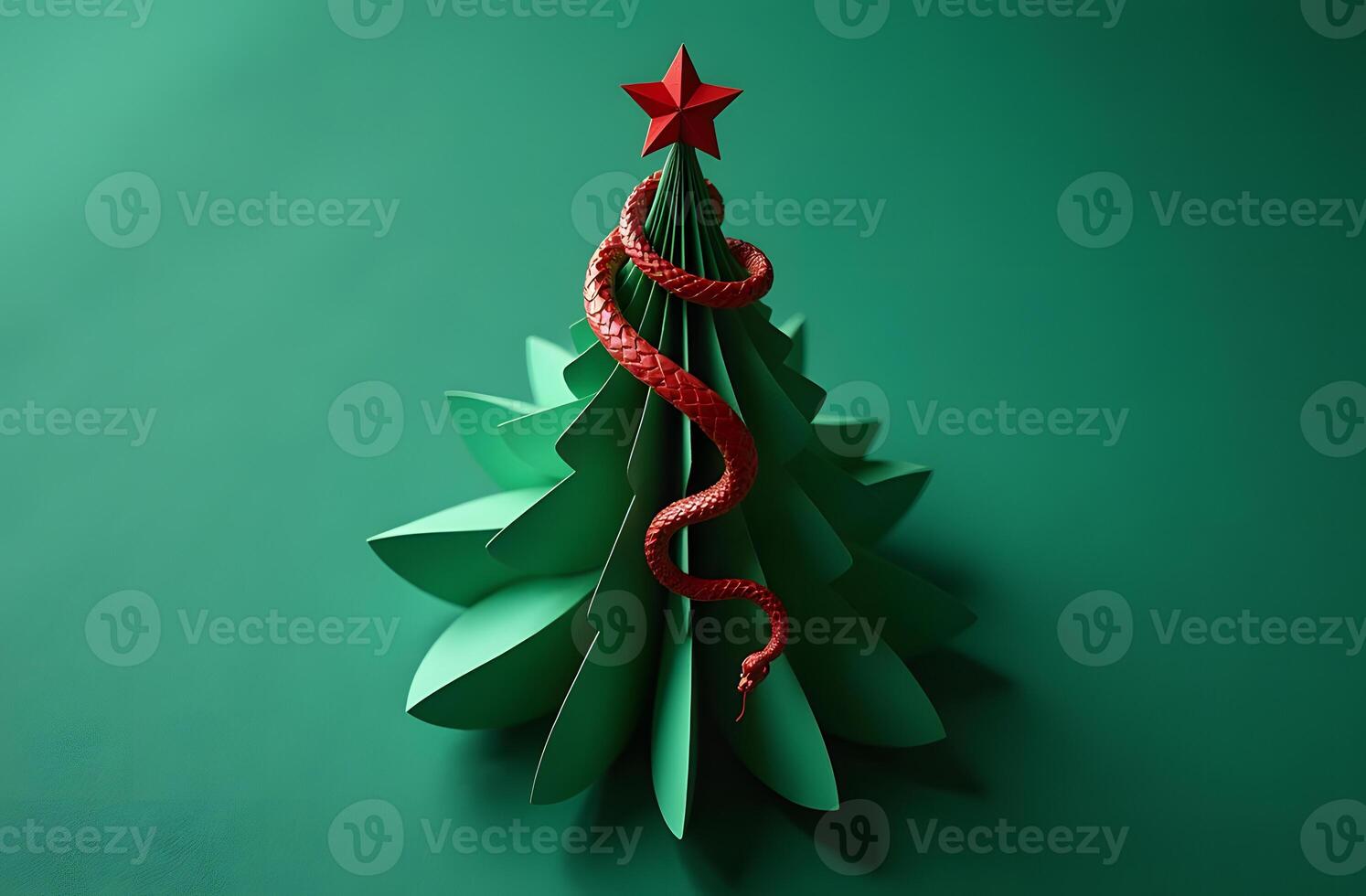 Abstract Christmas tree made of green paper with a red snake, symbolizing 2025 photo
