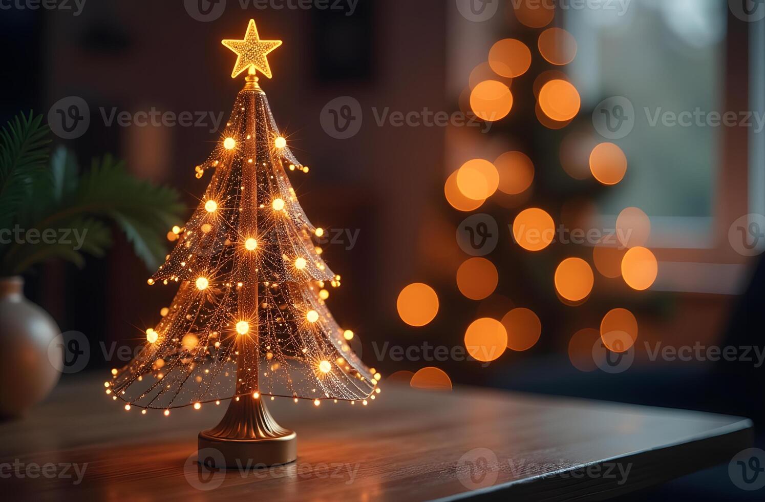 Miniature Christmas tree with delicate string lights and a star topper photo