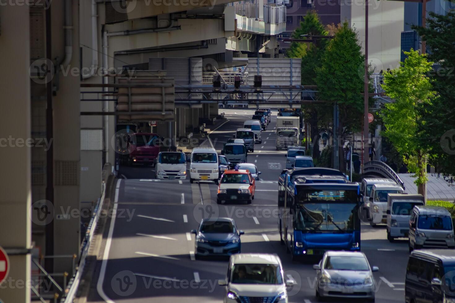 A cityscape of traffic jam at the city street in Yokohama in autumn telephoto shot photo