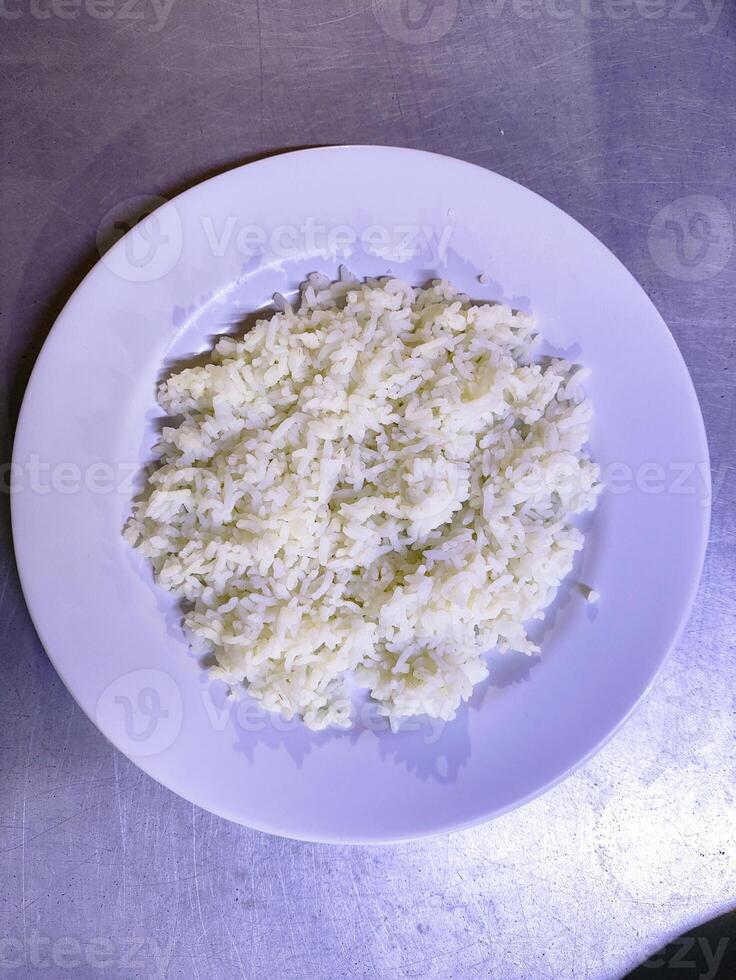 Steamed White Rice Served Fresh and Hot on a White Plate photo