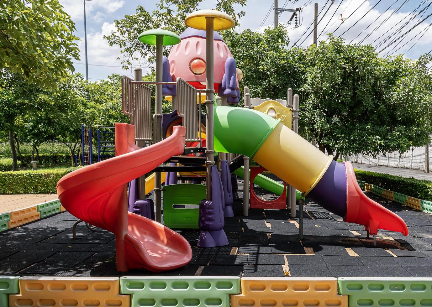 Colorful outdoor playground in park photo