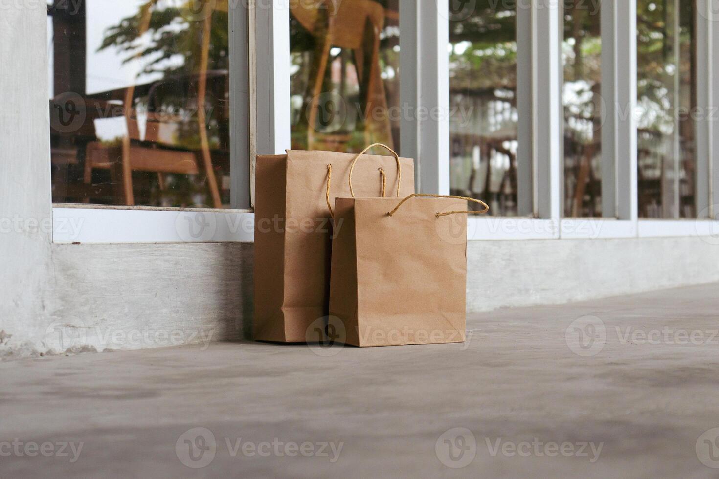 Package of paper bags lying in front of the house photo