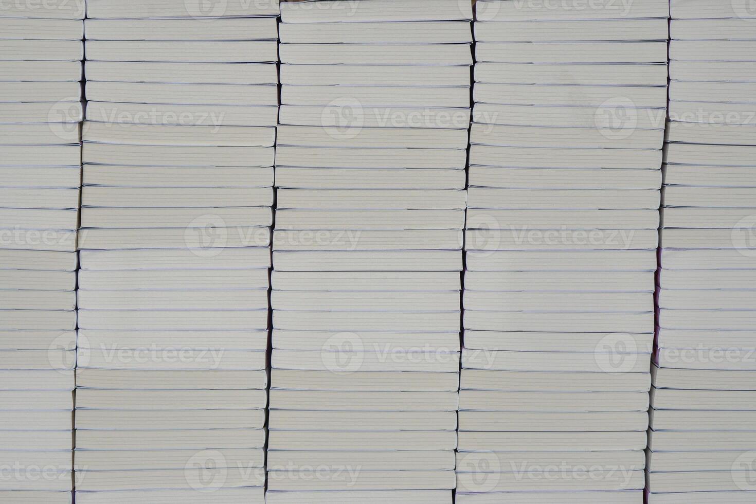 Stacks of books after going through printing production in the offset industry. Pile of books ready to enter the finishing stage of lamination photo