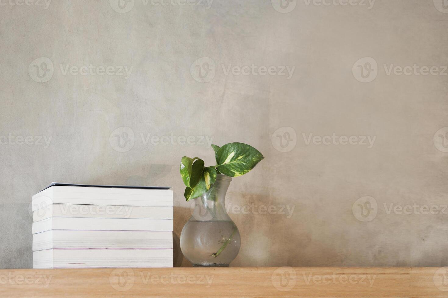 Stack of books on floating wooden bookshelf. Education and knowledge concept. Pile of books to read. House interior decoration photo