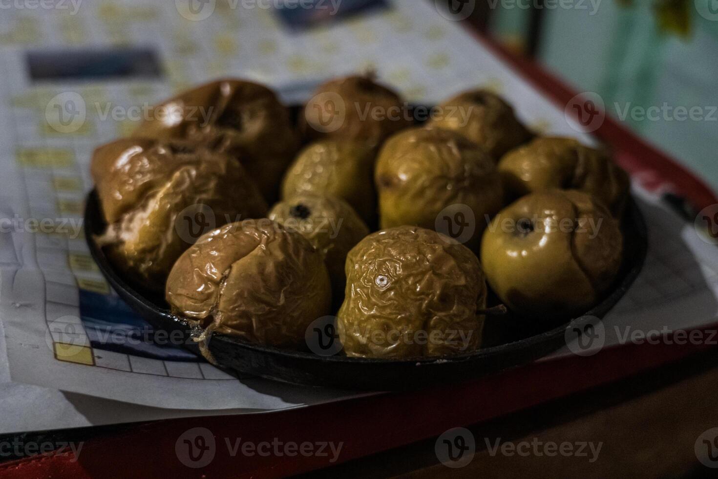 Apples are baked only from the oven. A rustic dish. Slavic dish photo