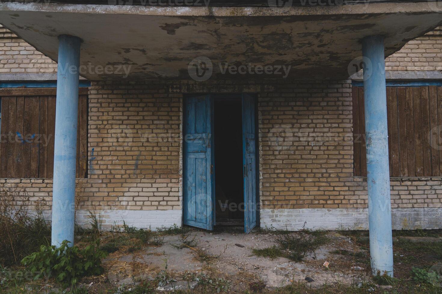 An old, abandoned, rustic store. The main entrance to the abandoned store photo