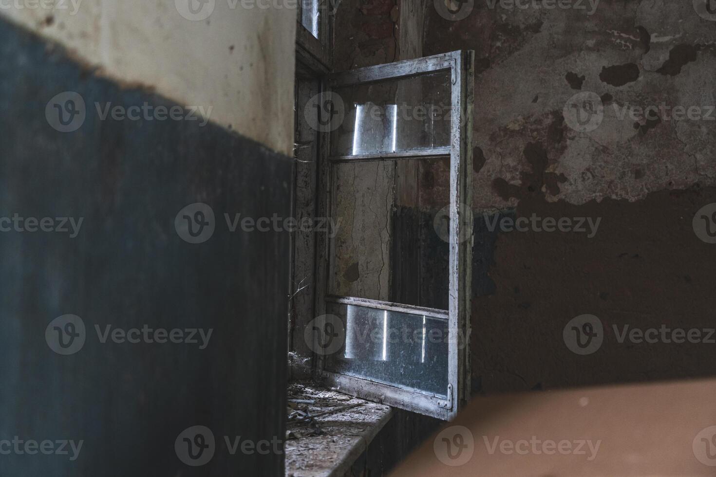 The open window of an old, abandoned, village store photo