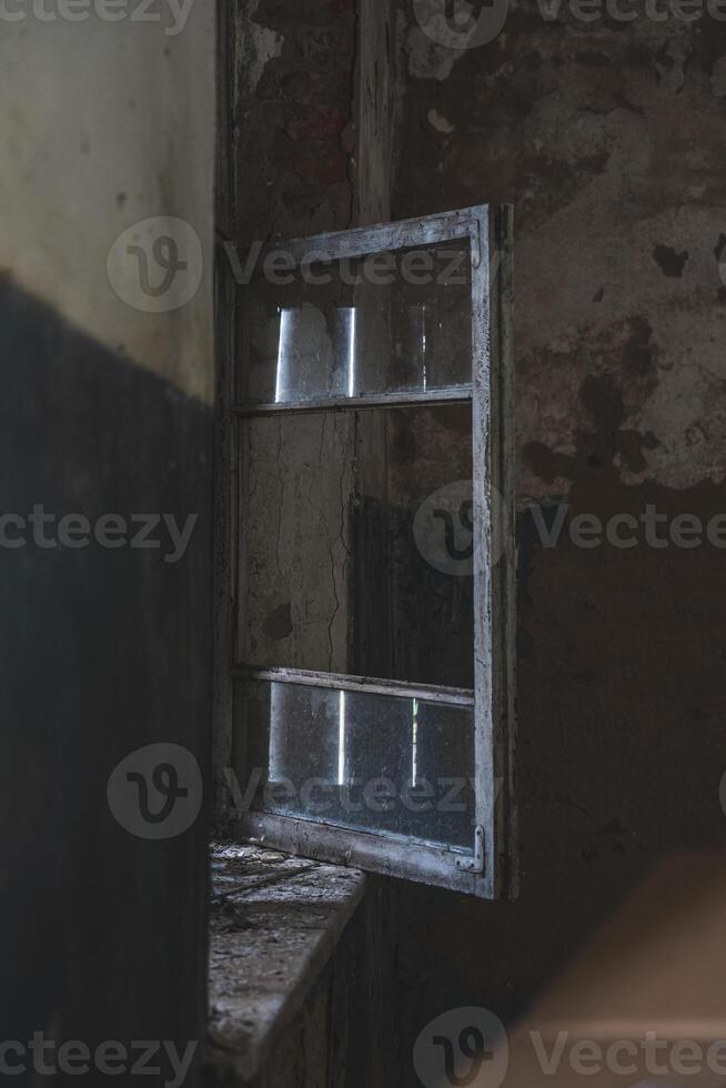 The open window of an old, abandoned, village store photo