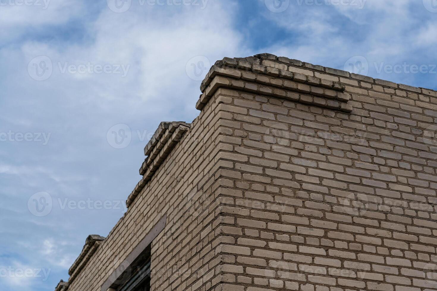 Corner of an old, abandoned, brick store building in the village photo