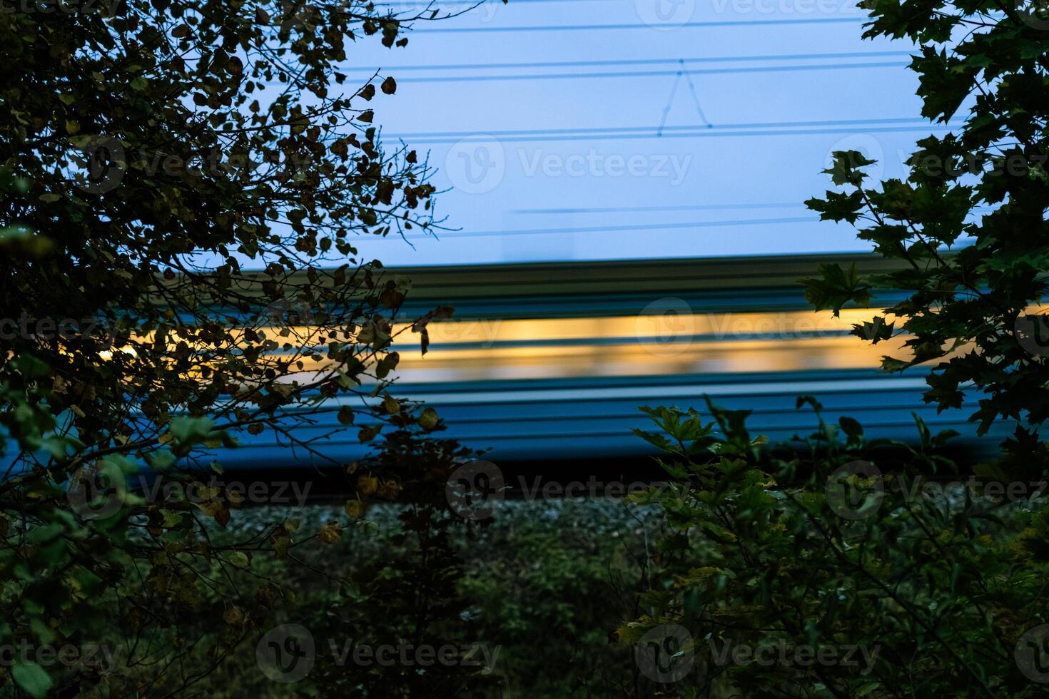 The electric train goes fast in the evening. Long exposure, lubrication photo