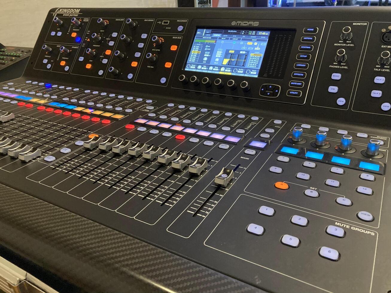 a large mixing console with many different knobs photo