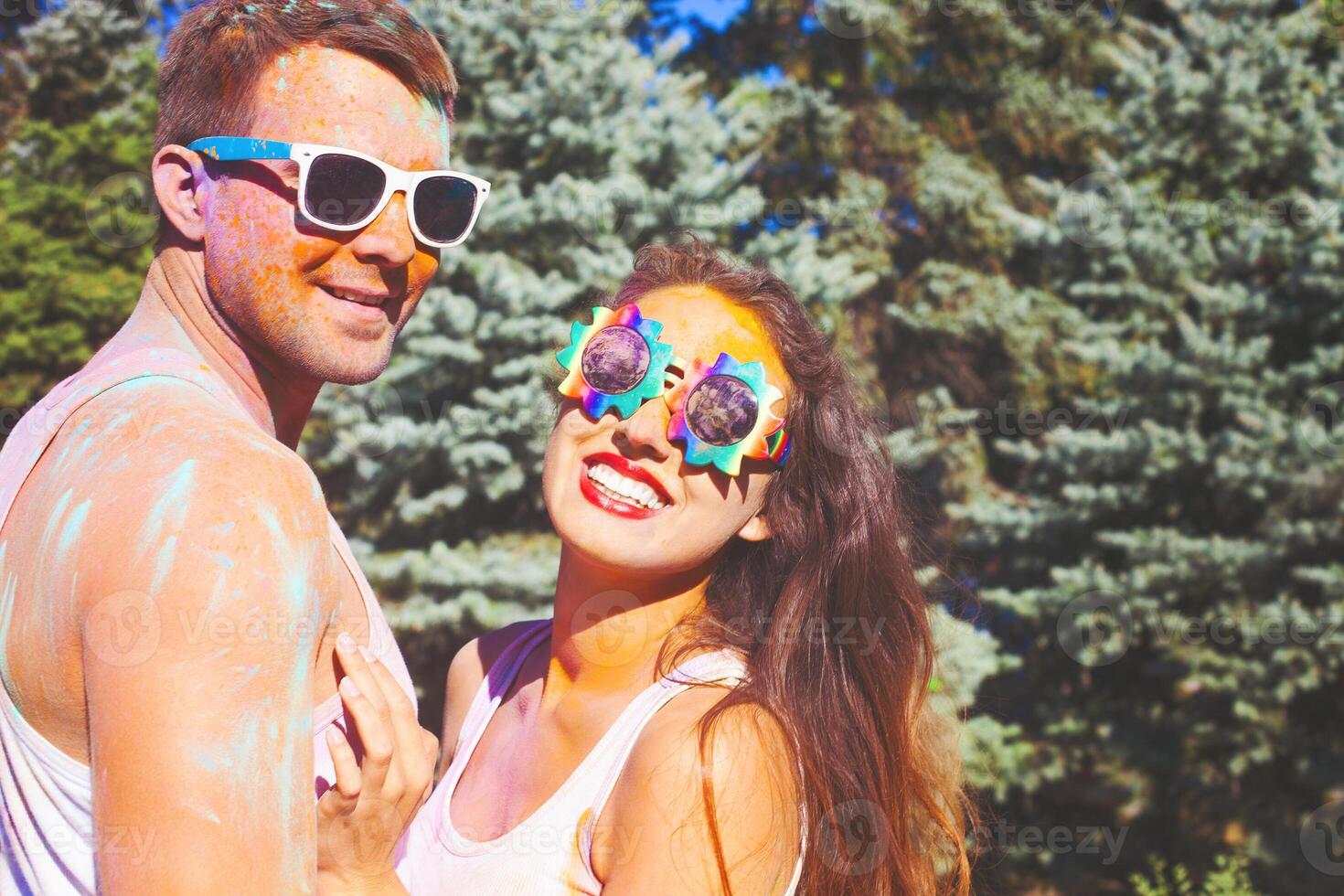 Happy couple in love on holi color festival photo