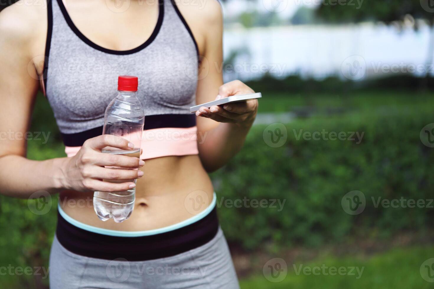 Fitness athlete woman resting drinking water photo