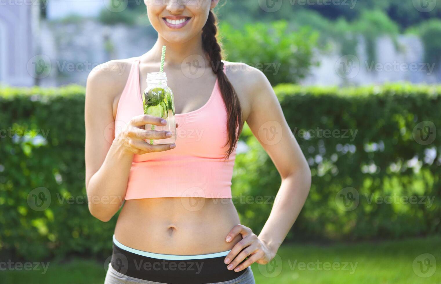 Fitness athlete woman resting drinking organic drink photo