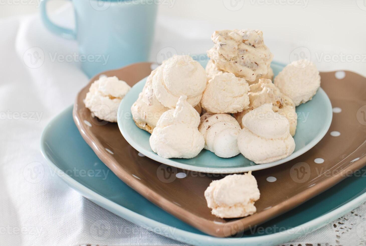 a plate with a bowl of meringue and a cup of coffee photo