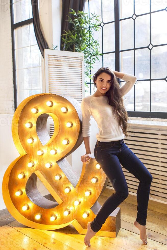 Portrait young beautiful brunette woman with long hair wearing photo