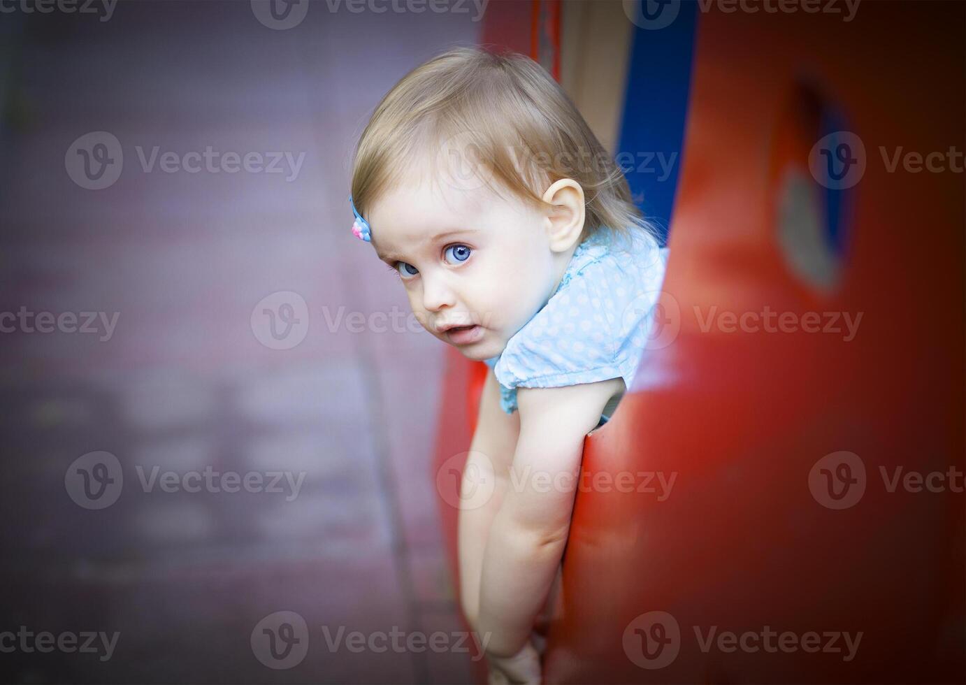 Little toddler girl on the playground photo