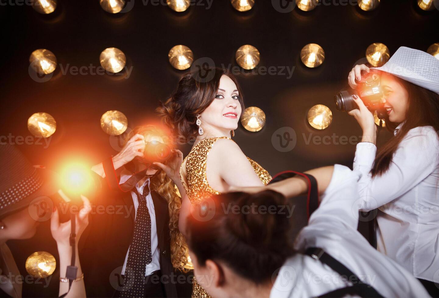 Superstar woman posing to paparazzi photo
