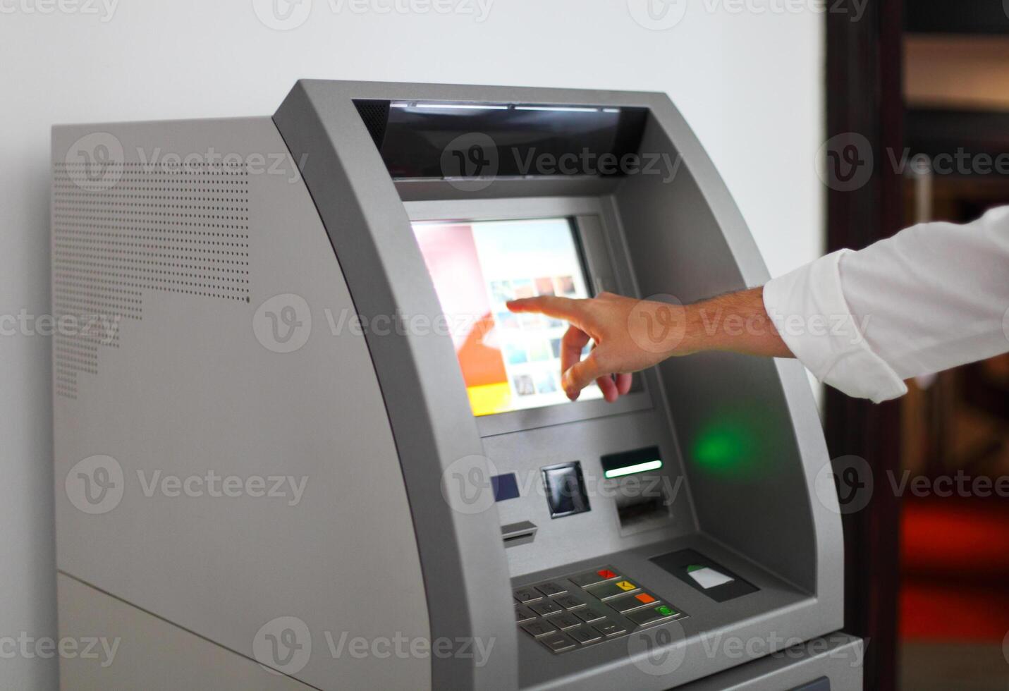 Man using banking machine photo