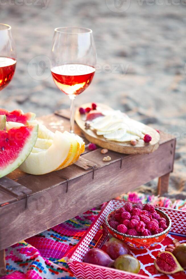 Outdoor picnic with rose wine photo