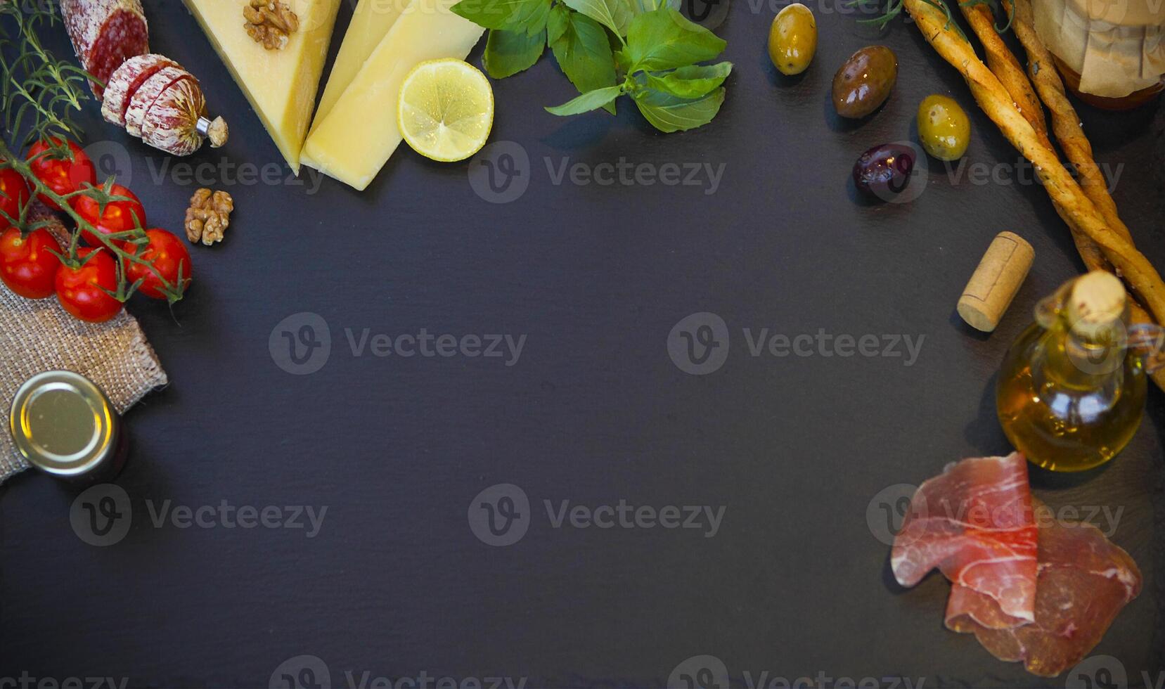 Raw organic vegetables with fresh ingredients for healthily cooking on vintage background photo