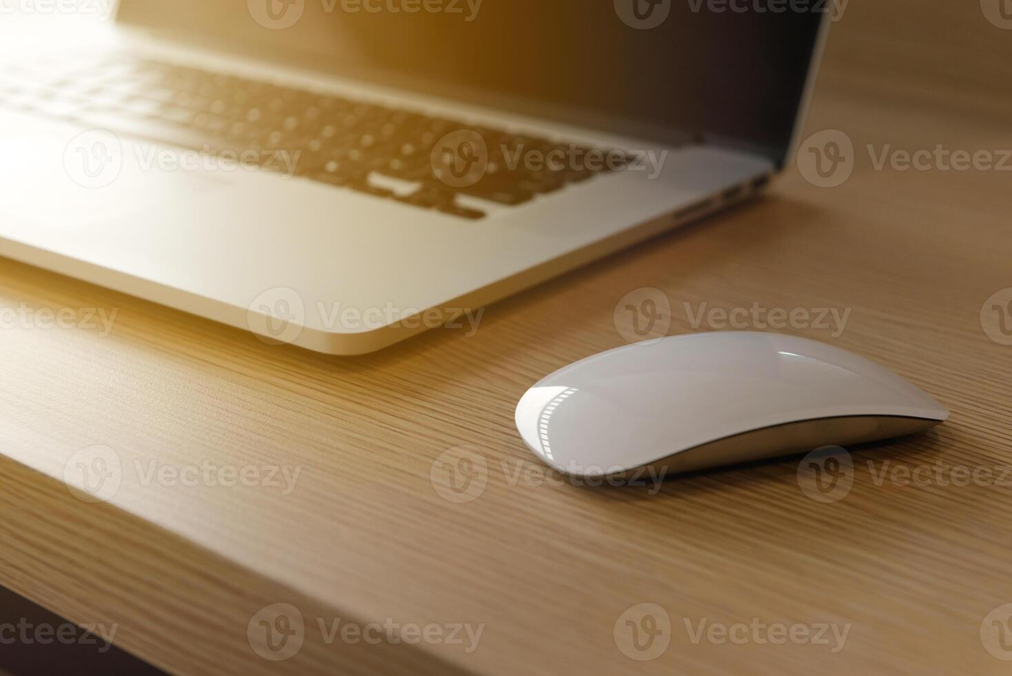 mouse and laptop computer on wooden desk in loft cafe. photo