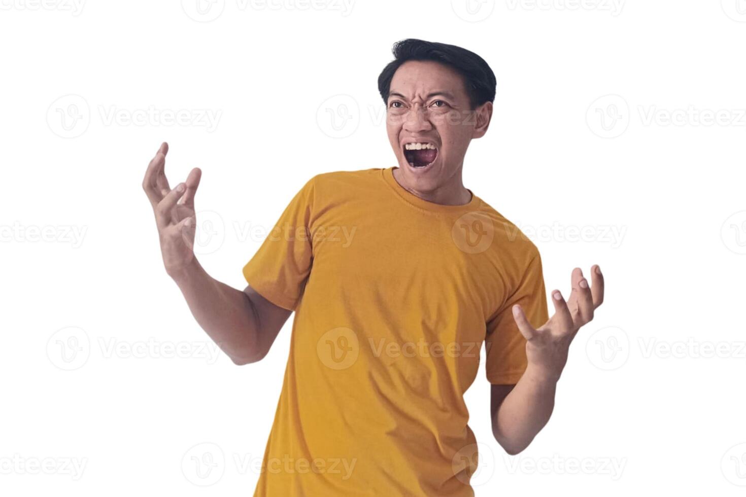 Portrait of an Asian man wearing a orange T-shirt, expressing surprise and shock with open palms, isolated against a white background. photo