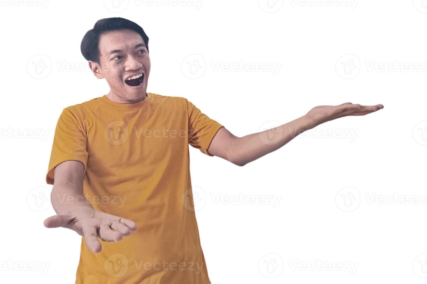 Portrait of an Asian man wearing a orange T-shirt, expressing surprise and shock with open palms, isolated against a white background. photo
