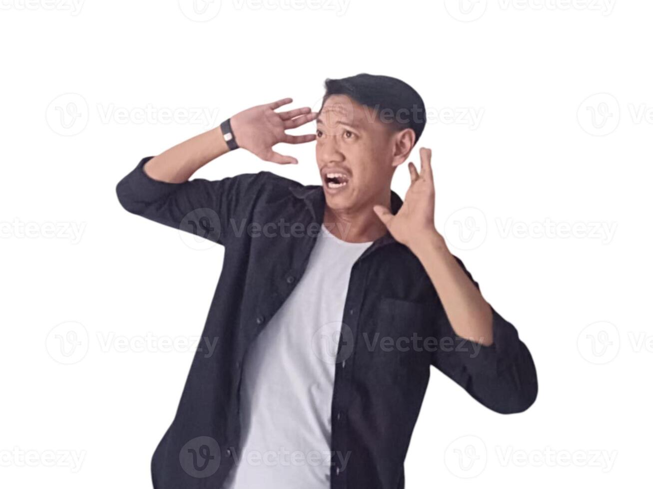 Young asian man holding mobile phone surprised in casual shirt showing copy space on palm isolated on white background. Good offer concept photo