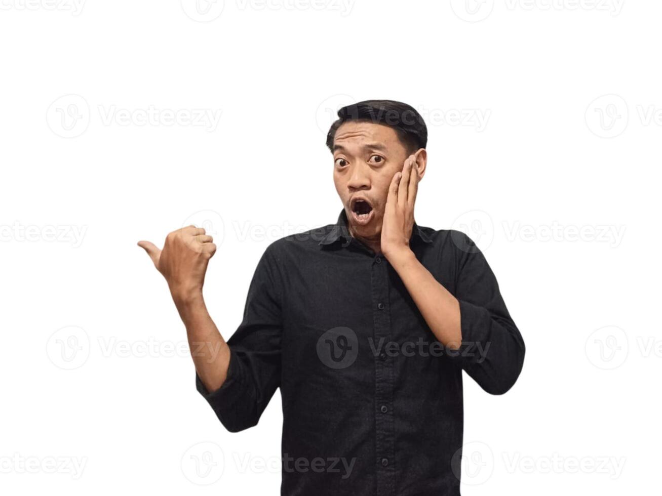 Young asian man holding mobile phone surprised in casual shirt showing copy space on palm isolated on white background. Good offer concept photo