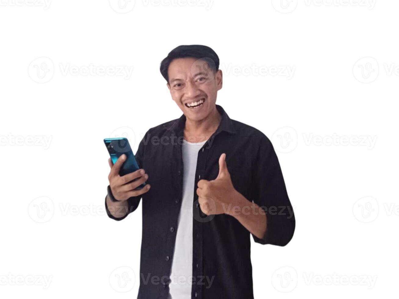 Young asian man holding mobile phone surprised in casual shirt showing copy space on palm isolated on white background. Good offer concept photo