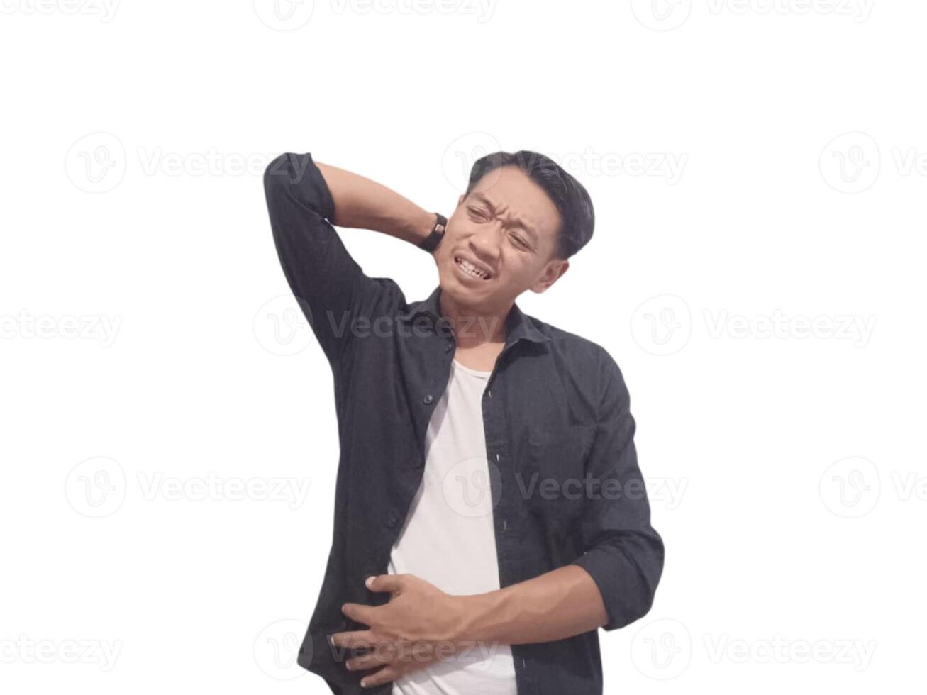 A man in a black shirt holds his neck with a pained expression, indicating discomfort or neck pain. The plain white background emphasizes his distress and highlights photo